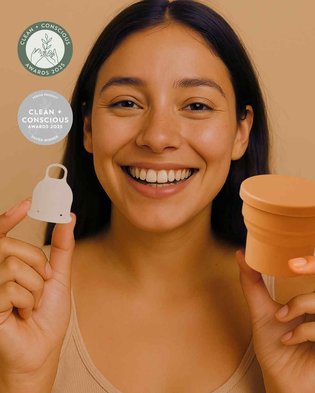 A woman holding Inoya period cup with menstrual cup steriliser