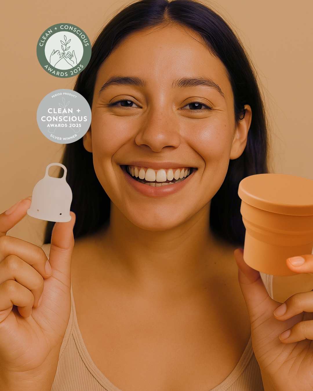 A woman holding Inoya menstrual cup with a menstrual cup steriliser by Inoya 