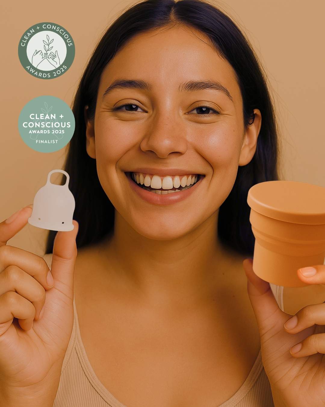 A woman holding Inoya period cup with menstrual cup steriliser