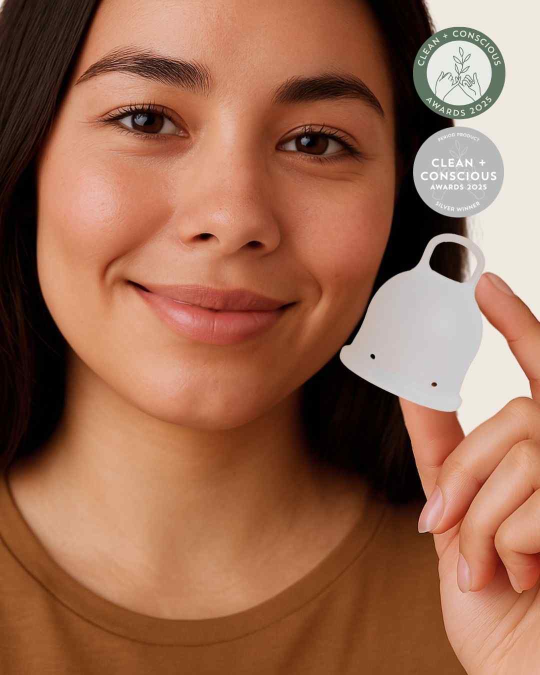 A woman holding Inoya period cup