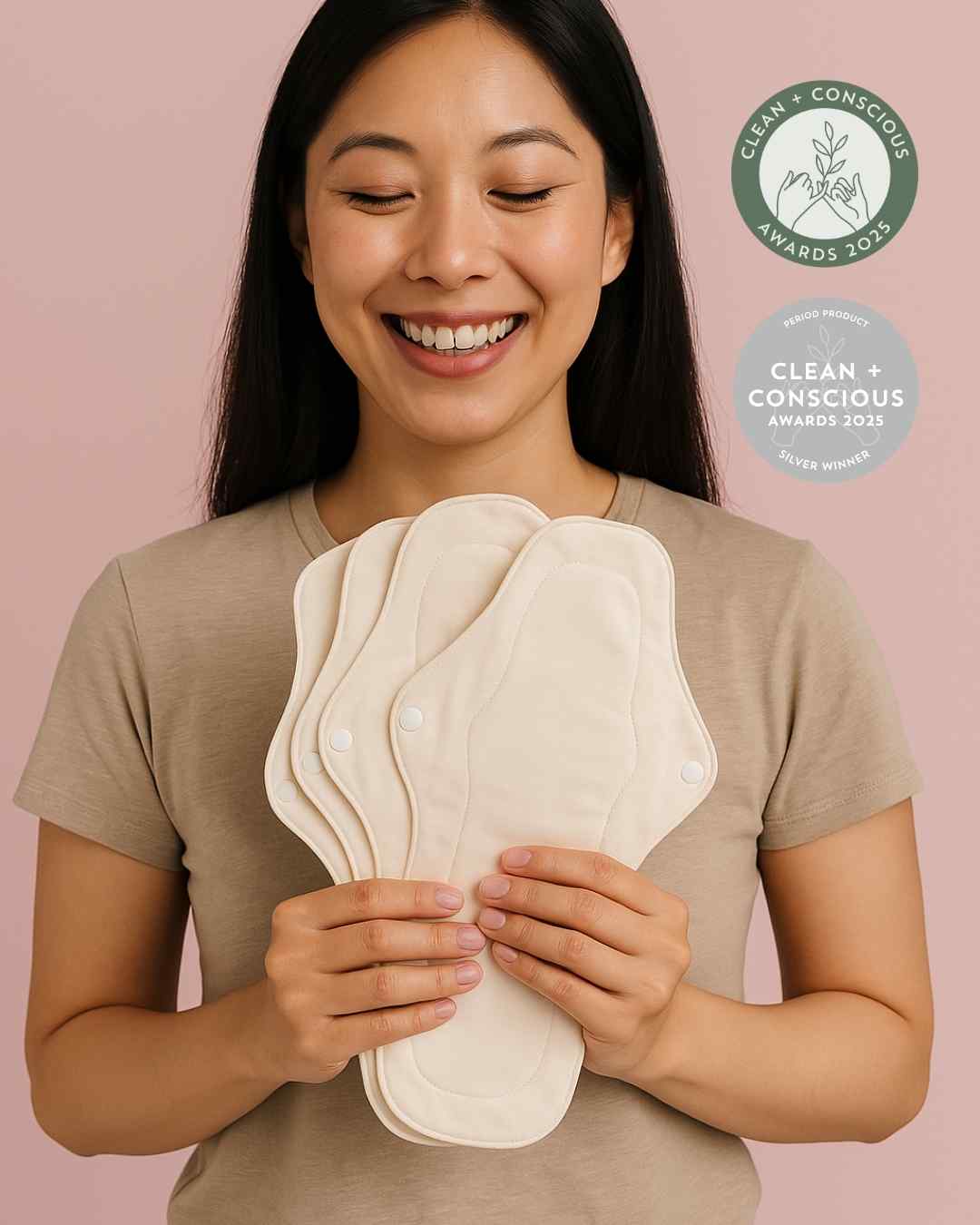 A woman holding reusable pads for period 
