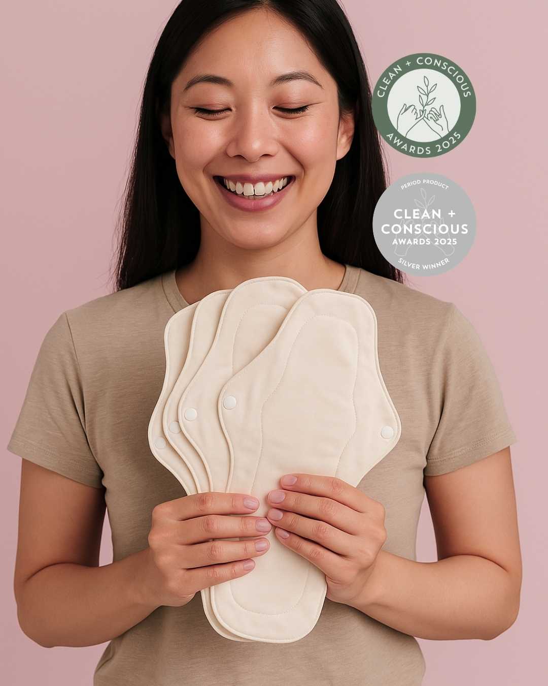 A woman holding Inoya reusable pads