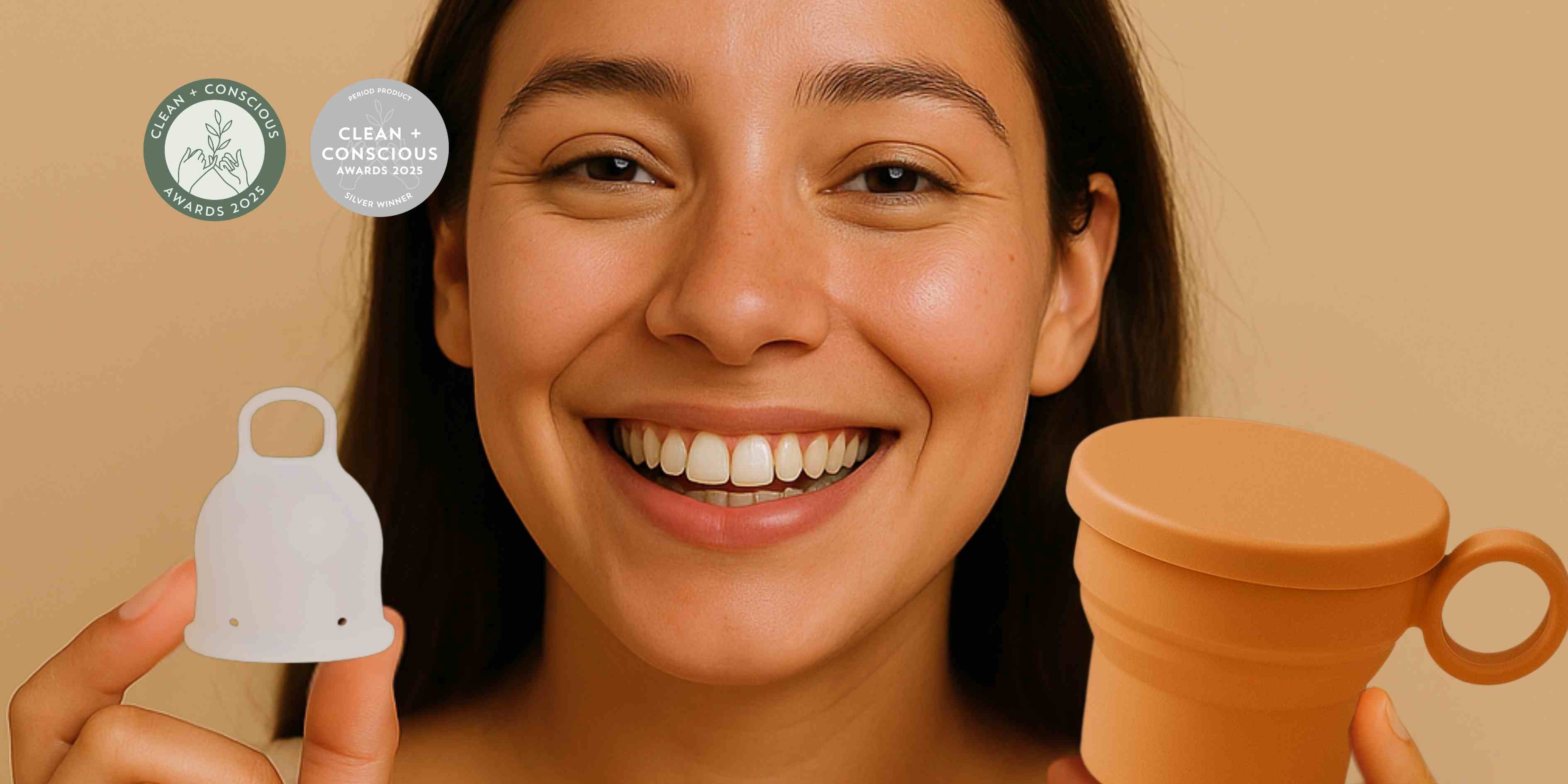 A woman holding Inoya period cup with a menstrual cup steriliser 