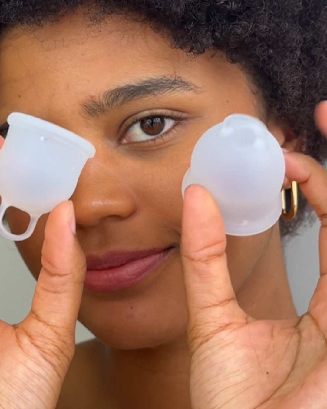A woman holding Inoya period cups