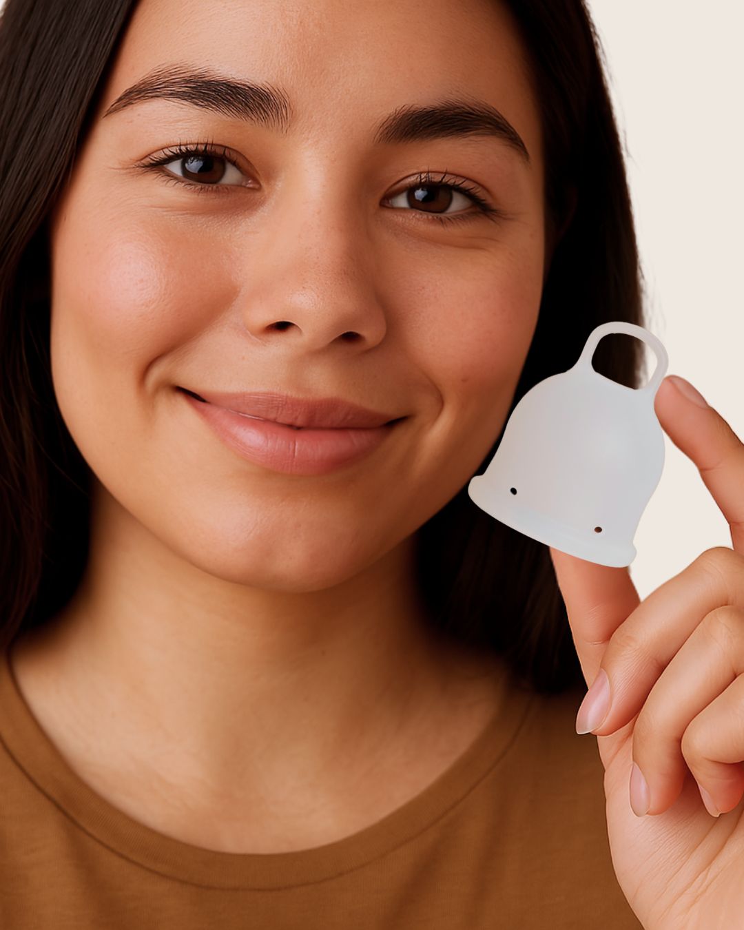 A woman holding Inoya period cup